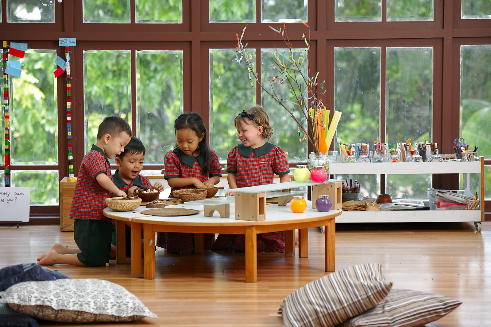 Four EtonHouse Nature Pre-School students were having fun during class