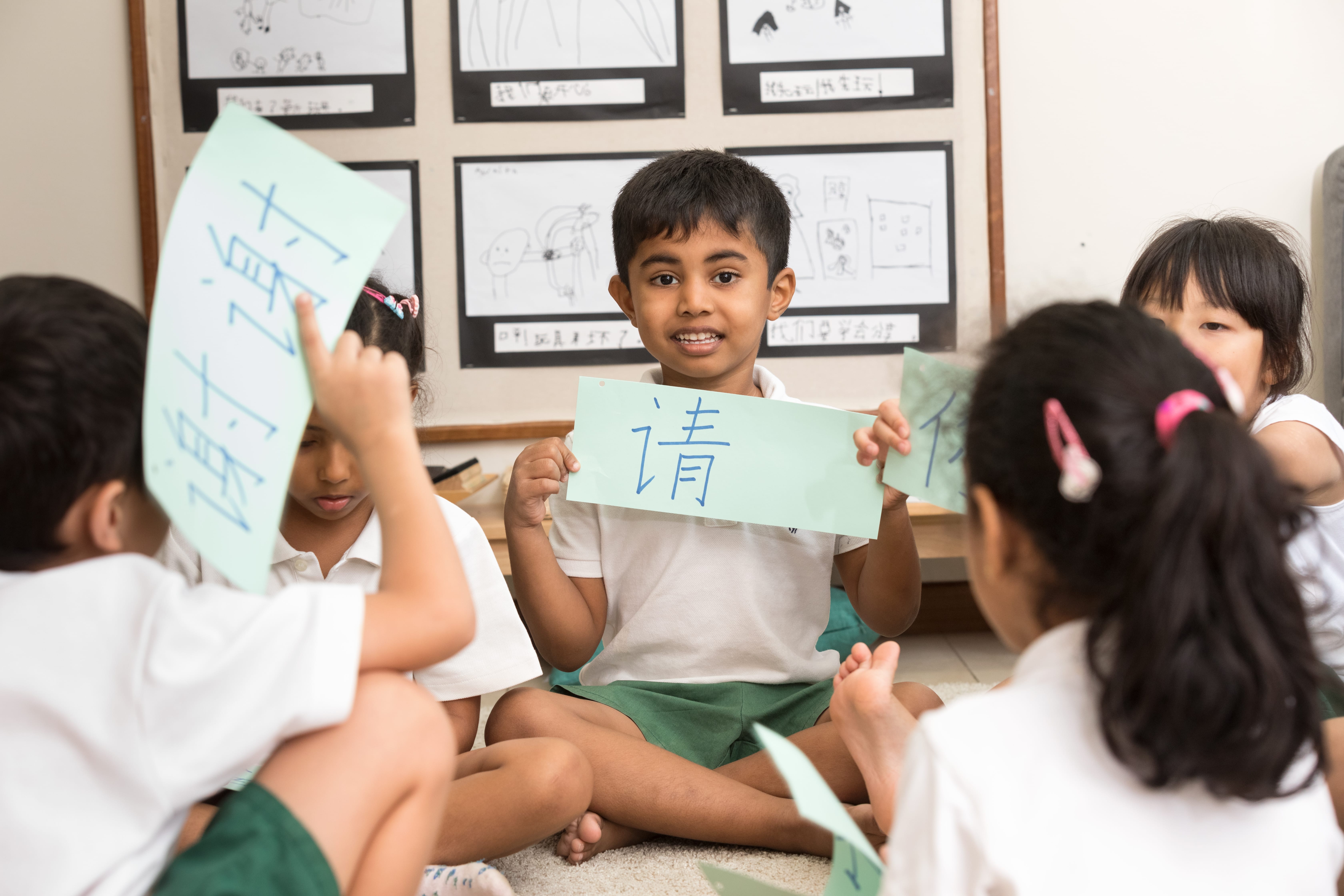 Group of students of EtonHouse Nature Pre-School learning Chinese characters