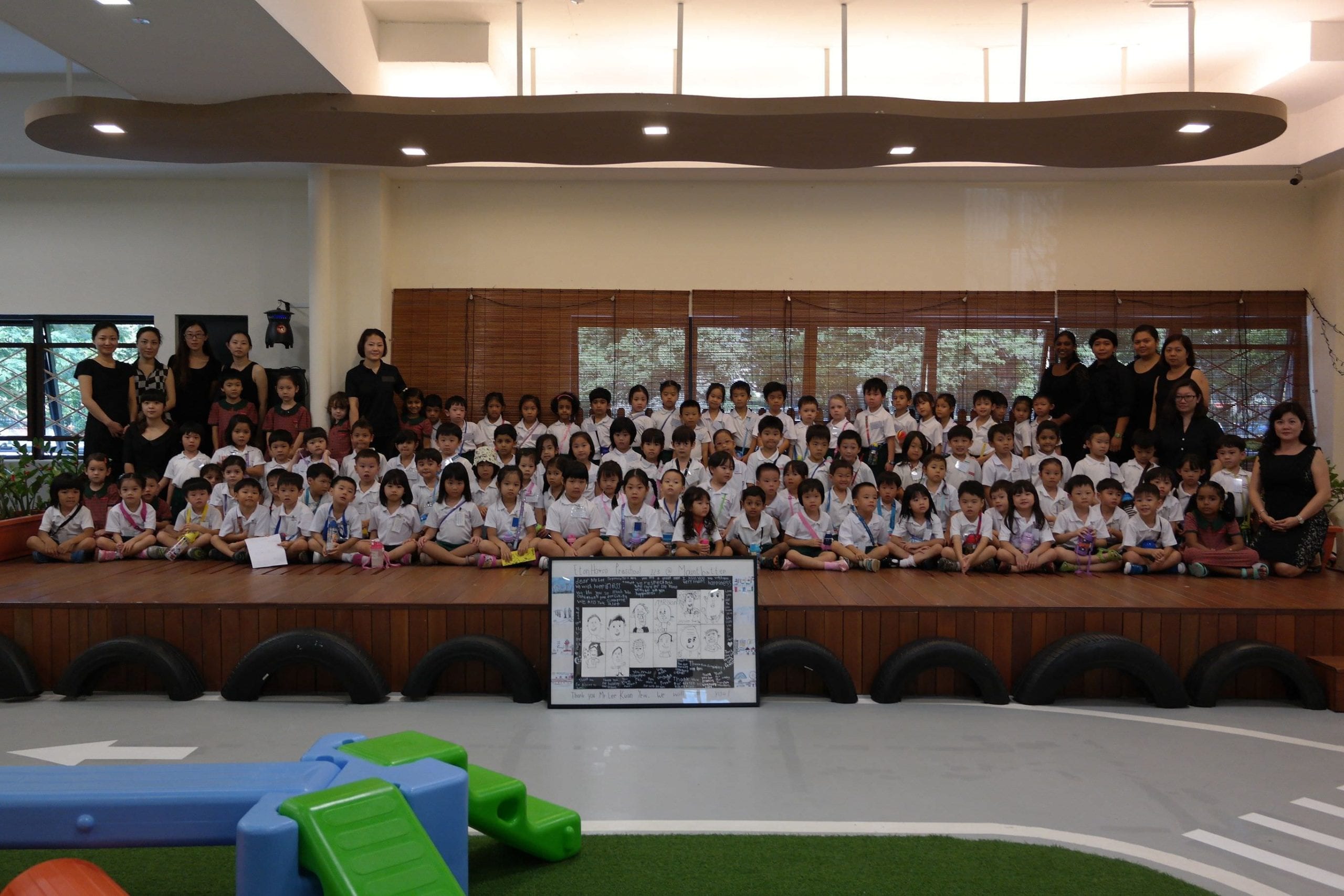 Group photo of EtonHouse children and teachers paying homage