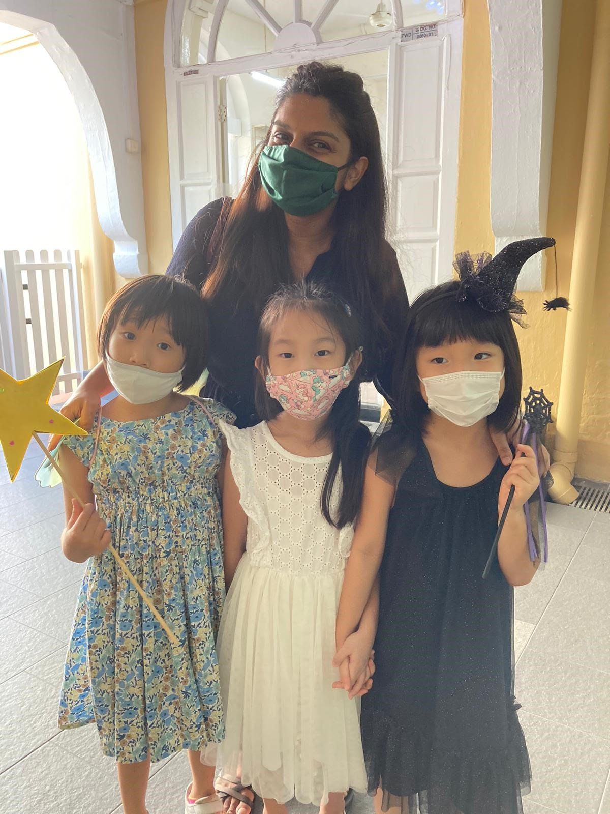 Image of Karin with her friends and teacher