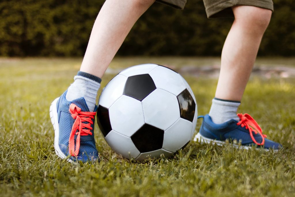 Boy kicking a soccer ball