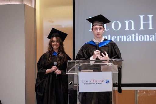 Etonhouse graduate students giving a speech at a podium