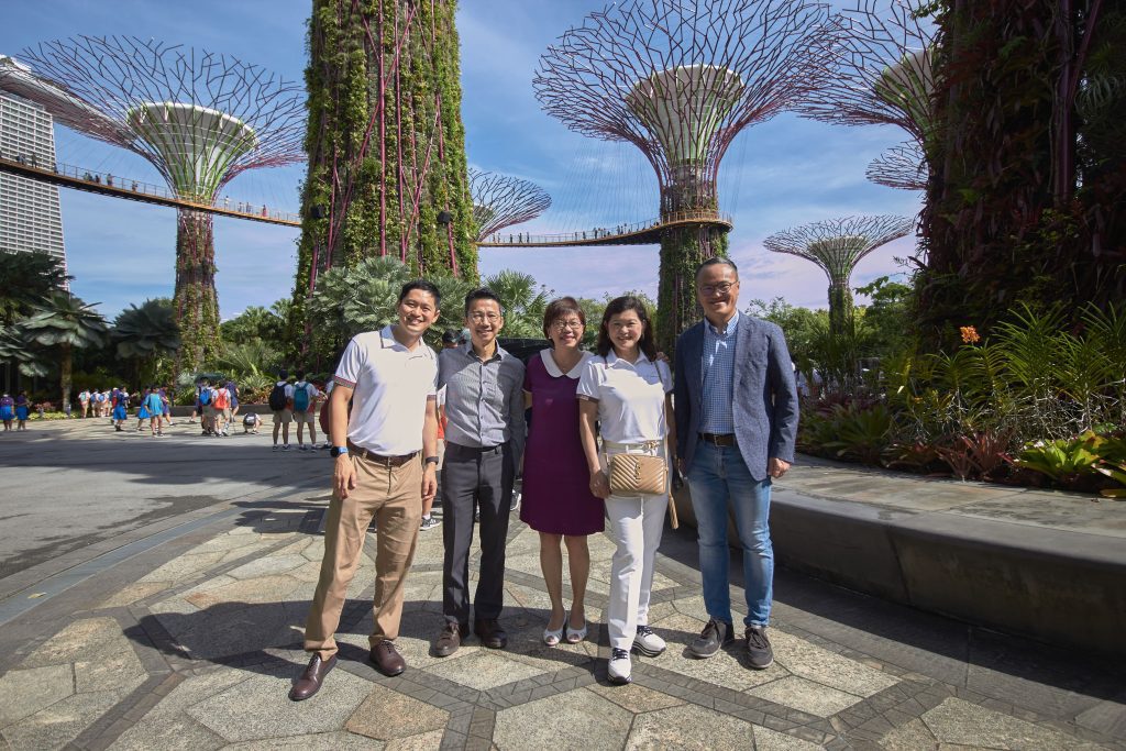 Etonhouse employee group photo beneath a supertree