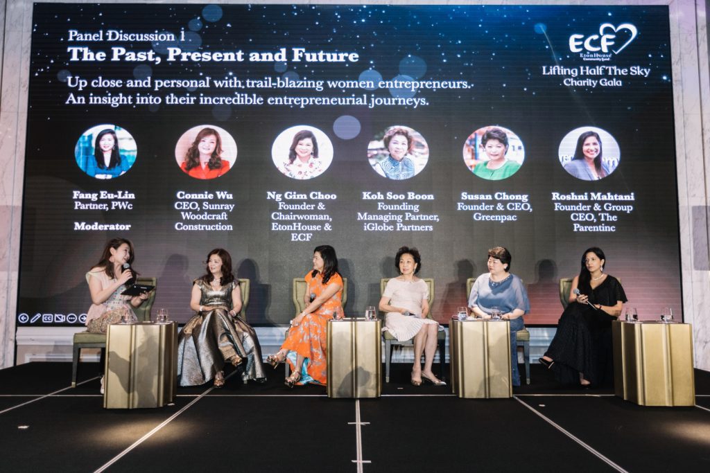 Panel of women entrepreneurs speaking at a charity gala