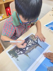 Student using a photo as a sketching reference