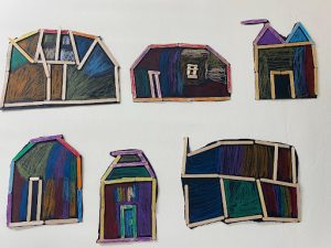 Various building shapes made from popsicle sticks