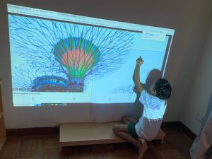 Student using a projector to trace a landmark