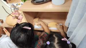 Students getting wooden blocks to use for playtime