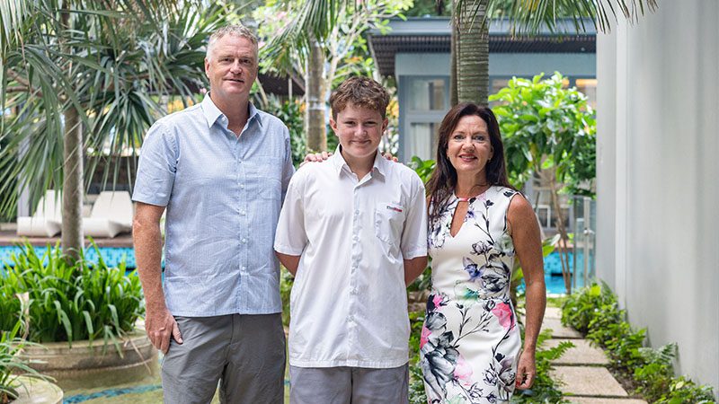 A family photo taken at a poolside