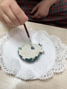 A vegetable replica being made using clay