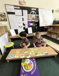 Children using flashcards to learn about different food groups
