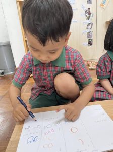 Young boy learning through drawing